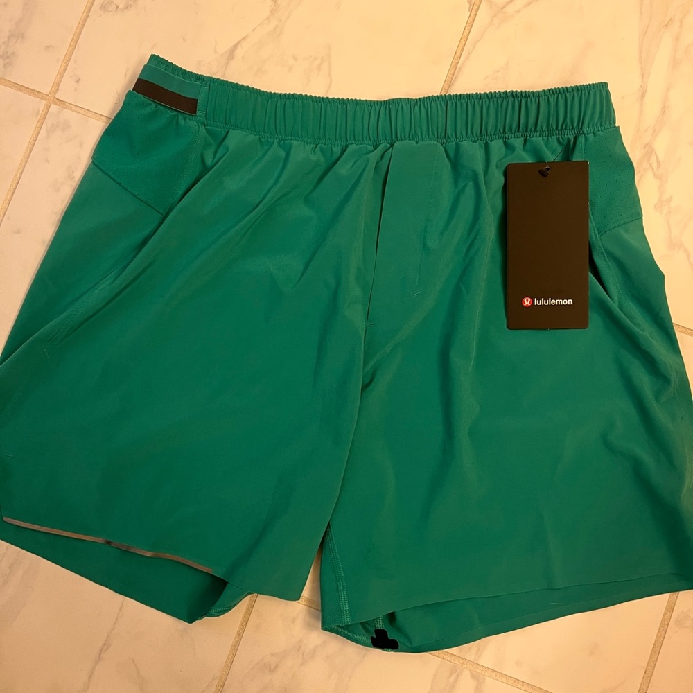 Surge short 6” liner less emerald ice NWT